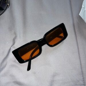 Stylish Black Sunglasses with Orange Lenses